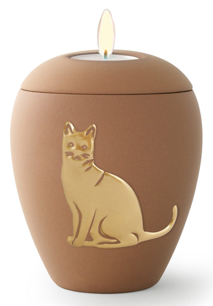 Tierurne aus samtener Keramik mit gold. Katzenrelief in sand